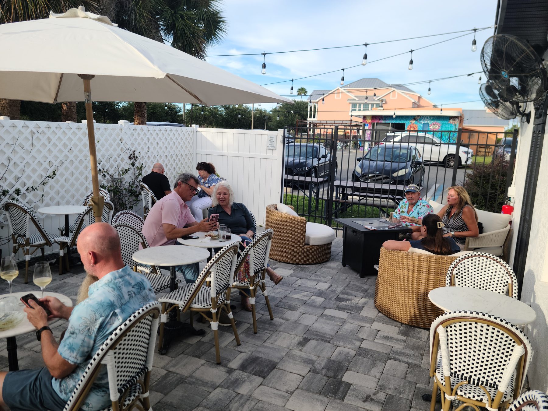Guests seated on the patio at the client appreciation dinner