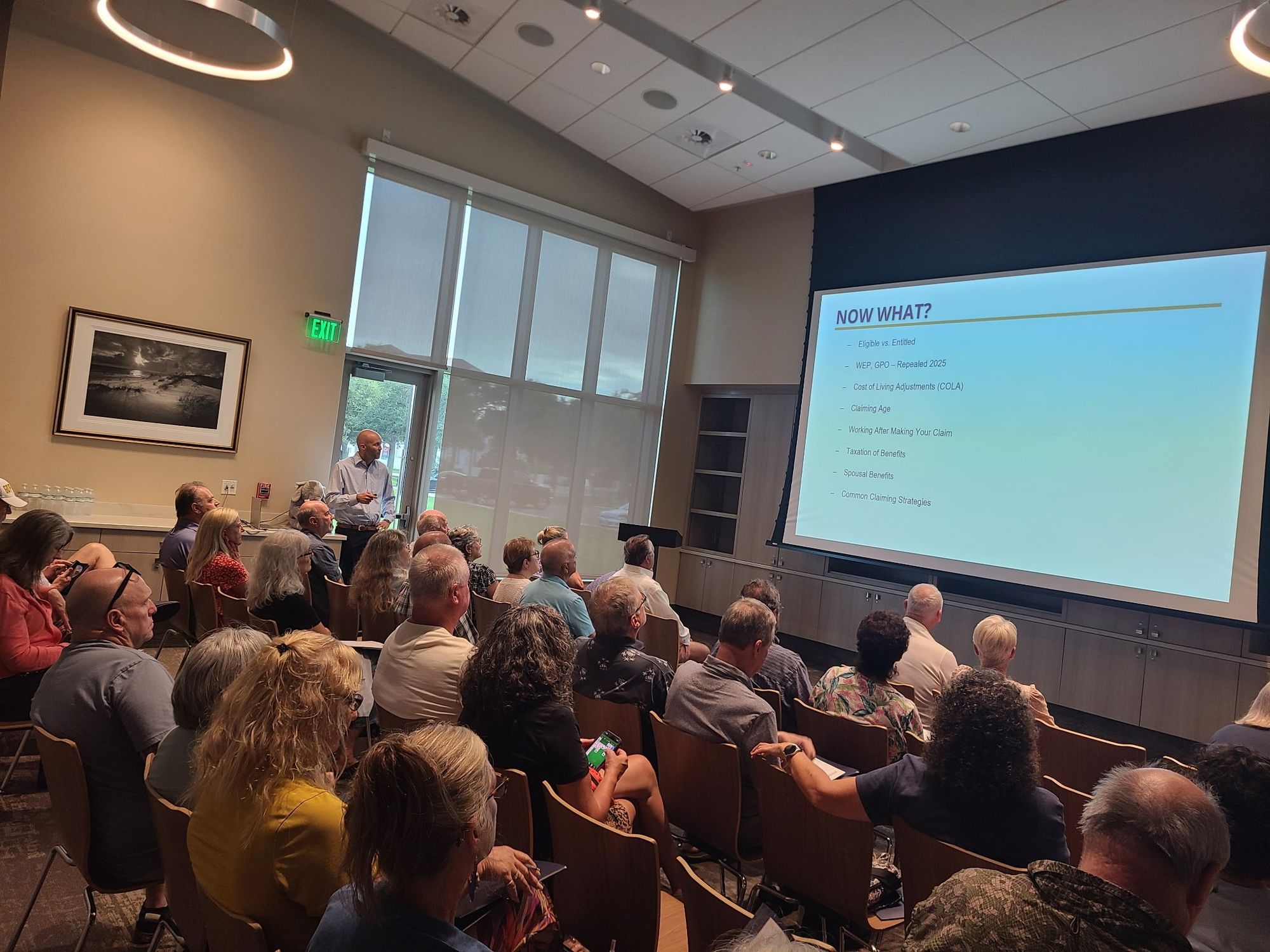 Steven Rich teaching a full room of retirees at a retirement planning workshop in New Smyrna Beach
